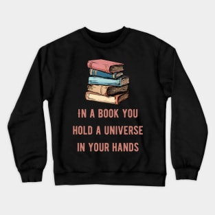In a book you hold a universe in your hands pink text Crewneck Sweatshirt